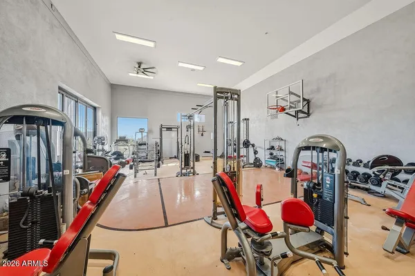 a bathroom with a granite countertop tub a sink and a mirror