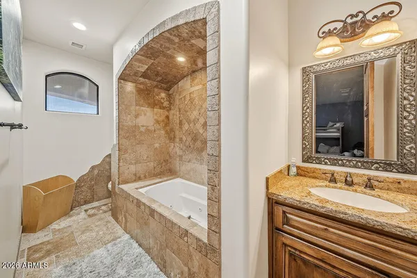 a view of a living room and kitchen floor to ceiling windows