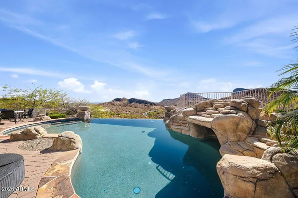 a view of a swimming pool with a chairs