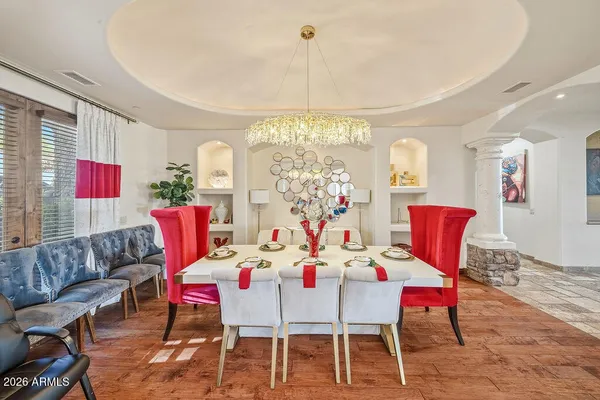 a view of a dining room with furniture window and wooden floor