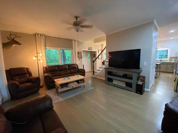 a living room with furniture and a window