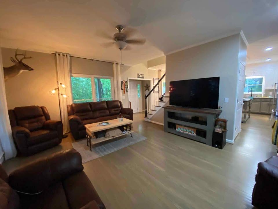 4005 South Apple Valley Road Commerce, GA 30529 - Photo 11 of 17 a living room with furniture and a flat screen tv