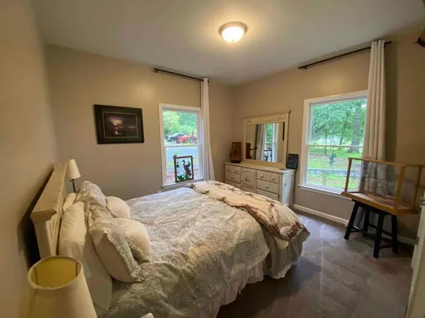 a bathroom with sink mirror and toilet