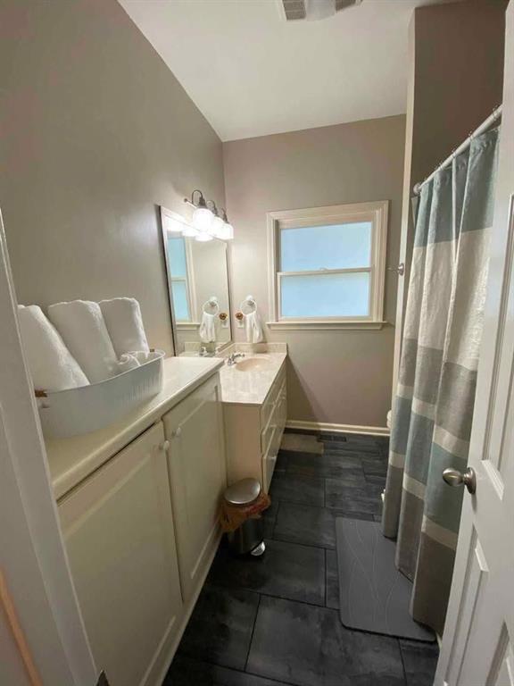 4005 South Apple Valley Road Commerce, GA 30529 - Photo 17 of 17 a bathroom with sink mirror and toilet