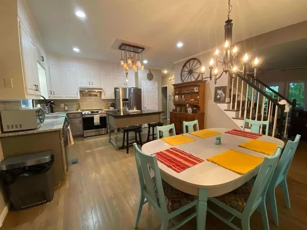 a kitchen with a counter space appliances and cabinets