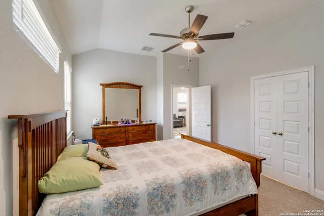 a bedroom with a bed and window