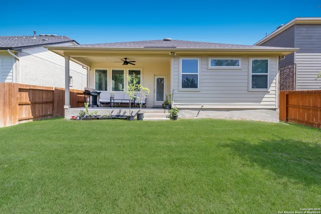 a front view of house with yard and outdoor seating