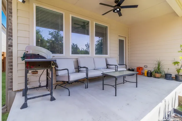 a living room with furniture and a window