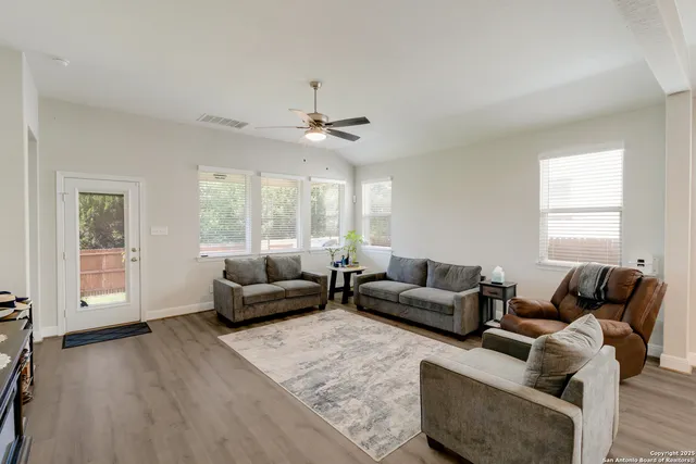 a living room with furniture and a window