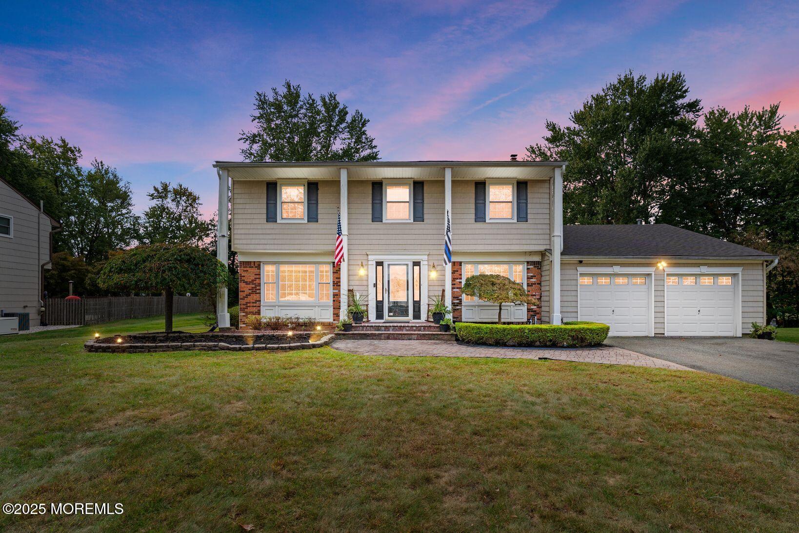 27 Farm Tree Road Manalapan, NJ 07726 - Photo 1 of 44 a front view of a house with a yard