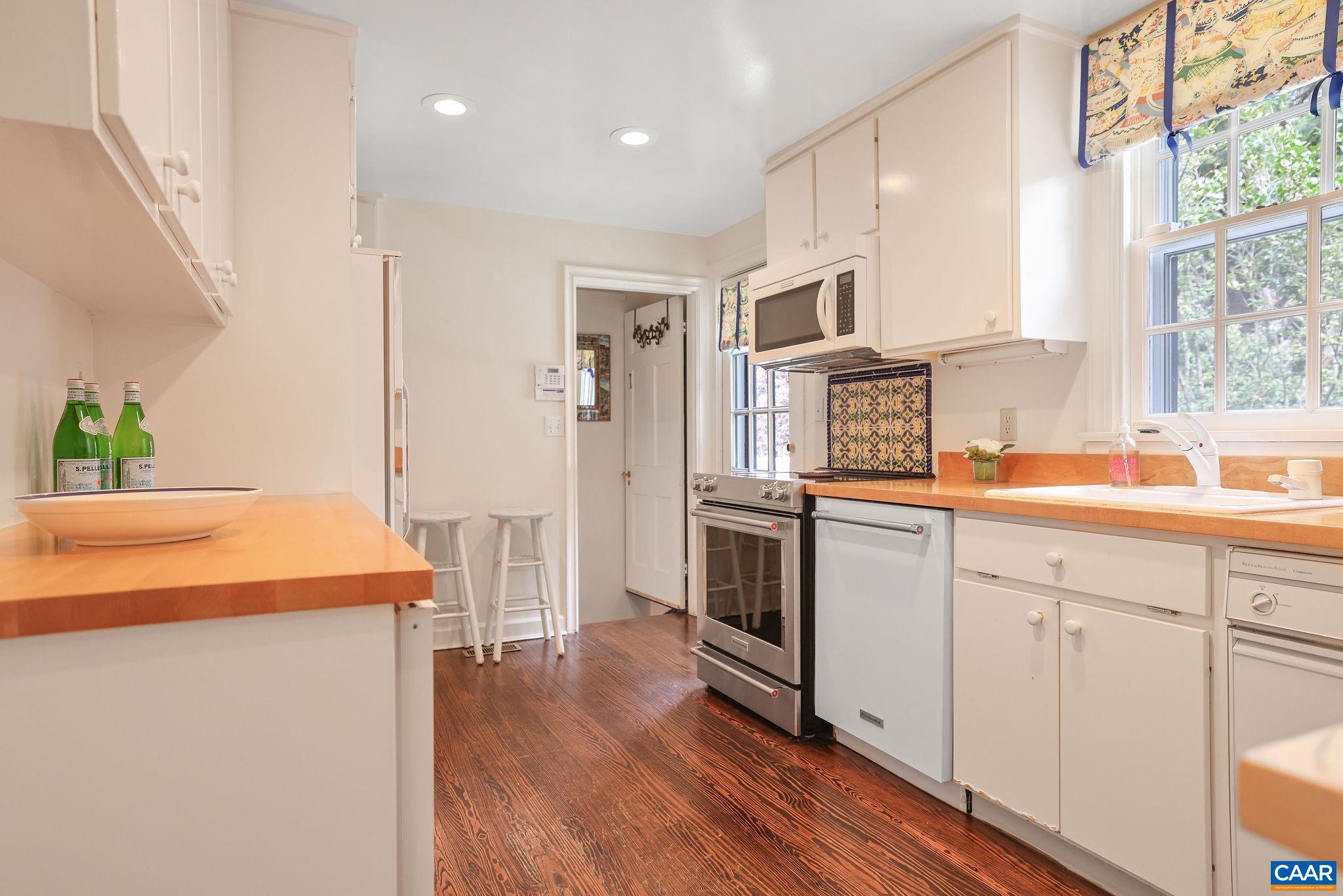 1335 Hilltop Road Charlottesville, VA 22903 - Photo 11 of 46 a kitchen with cabinets and wooden floor