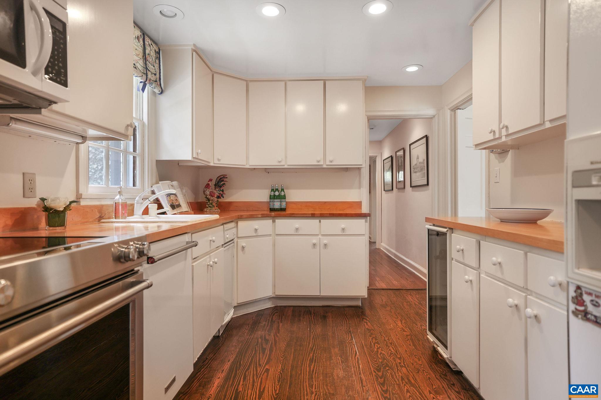 1335 Hilltop Road Charlottesville, VA 22903 - Photo 12 of 46 a kitchen with a sink cabinets stainless steel appliances and a window