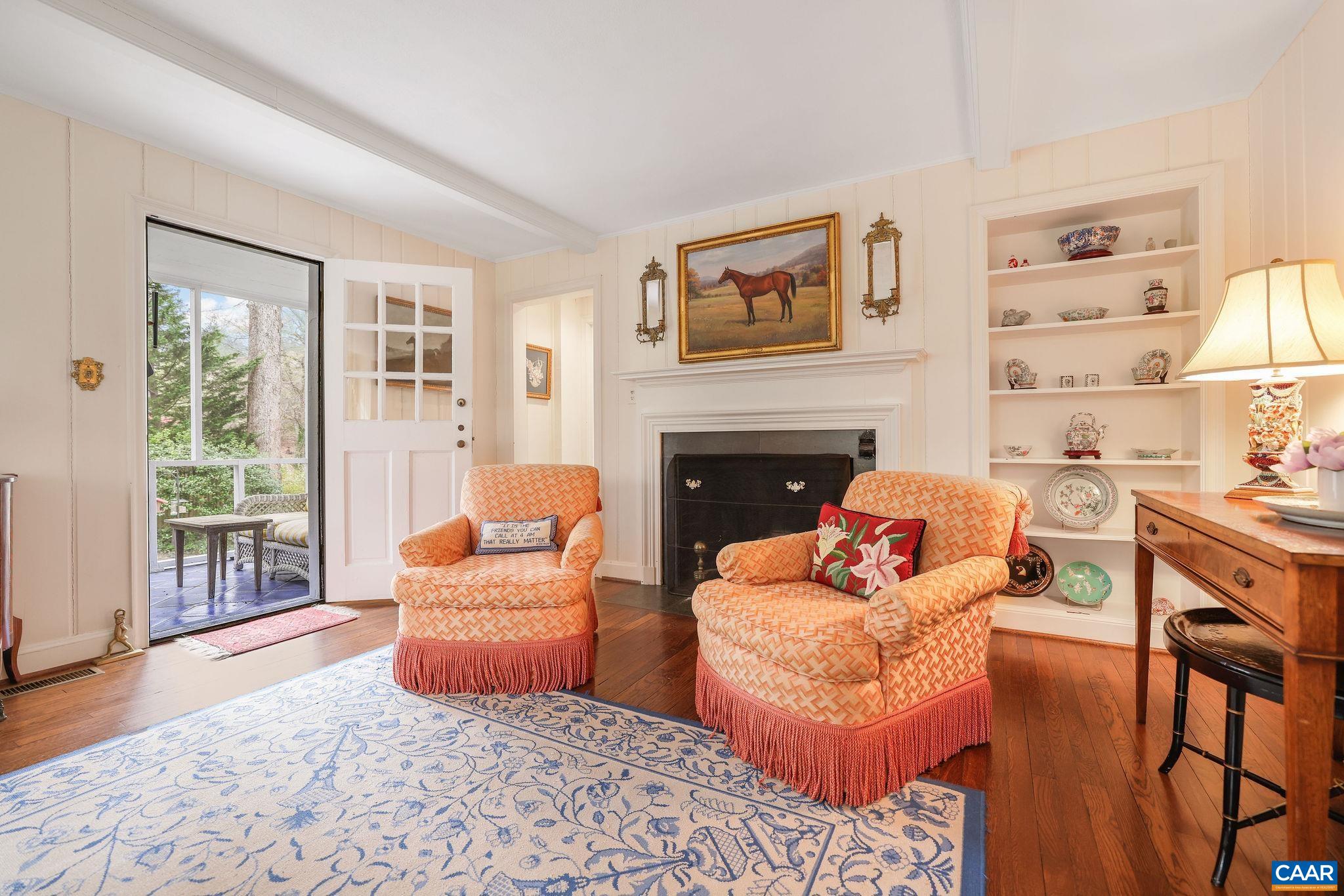 1335 Hilltop Road Charlottesville, VA 22903 - Photo 7 of 46 a living room with furniture and a fireplace