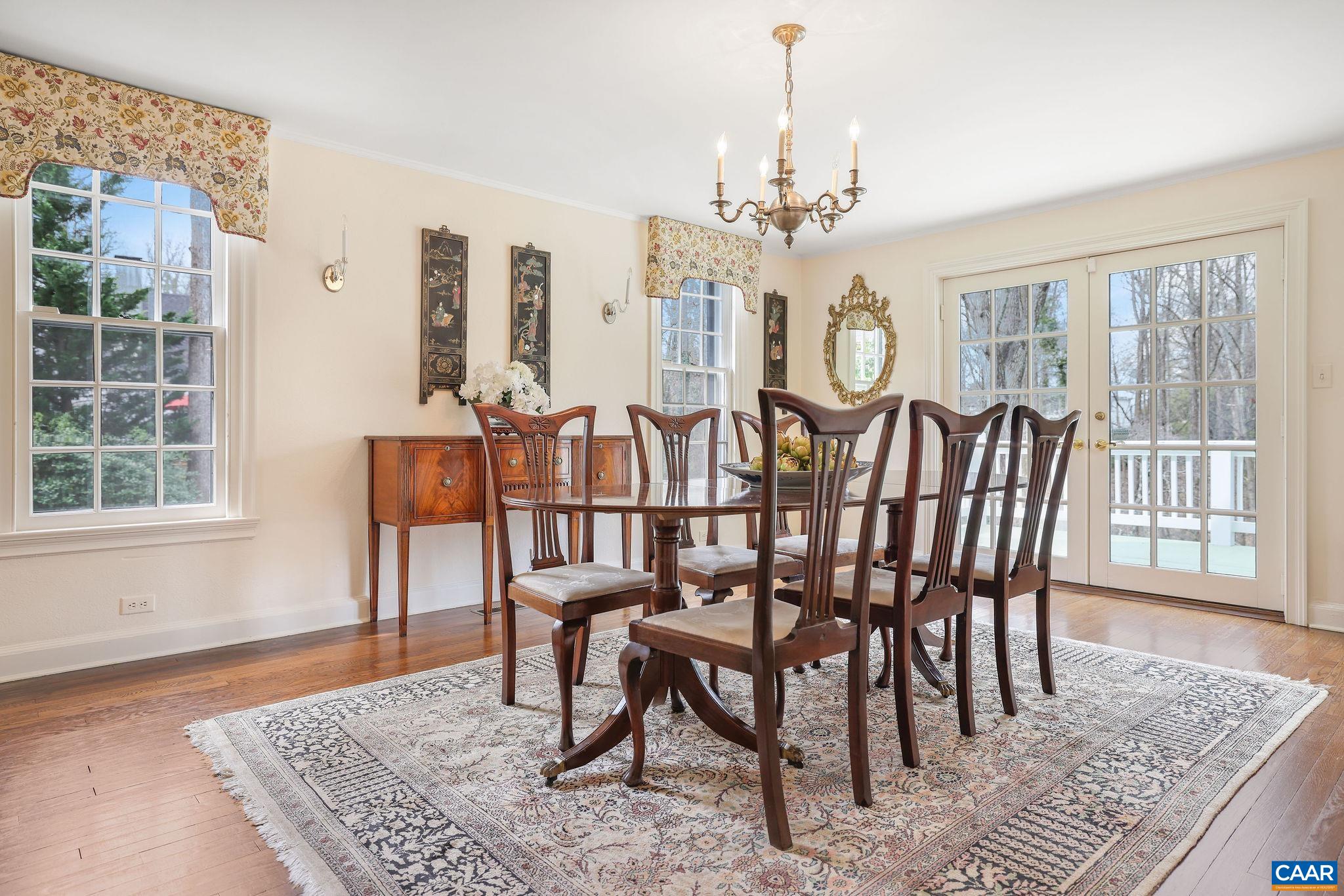 1335 Hilltop Road Charlottesville, VA 22903 - Photo 9 of 46 a view of a dining room with furniture window and wooden floor