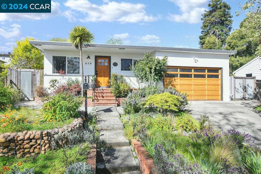 679 Rincon Road El Sobrante, CA 94803 - Photo 1 of 1 a front view of a house with garden