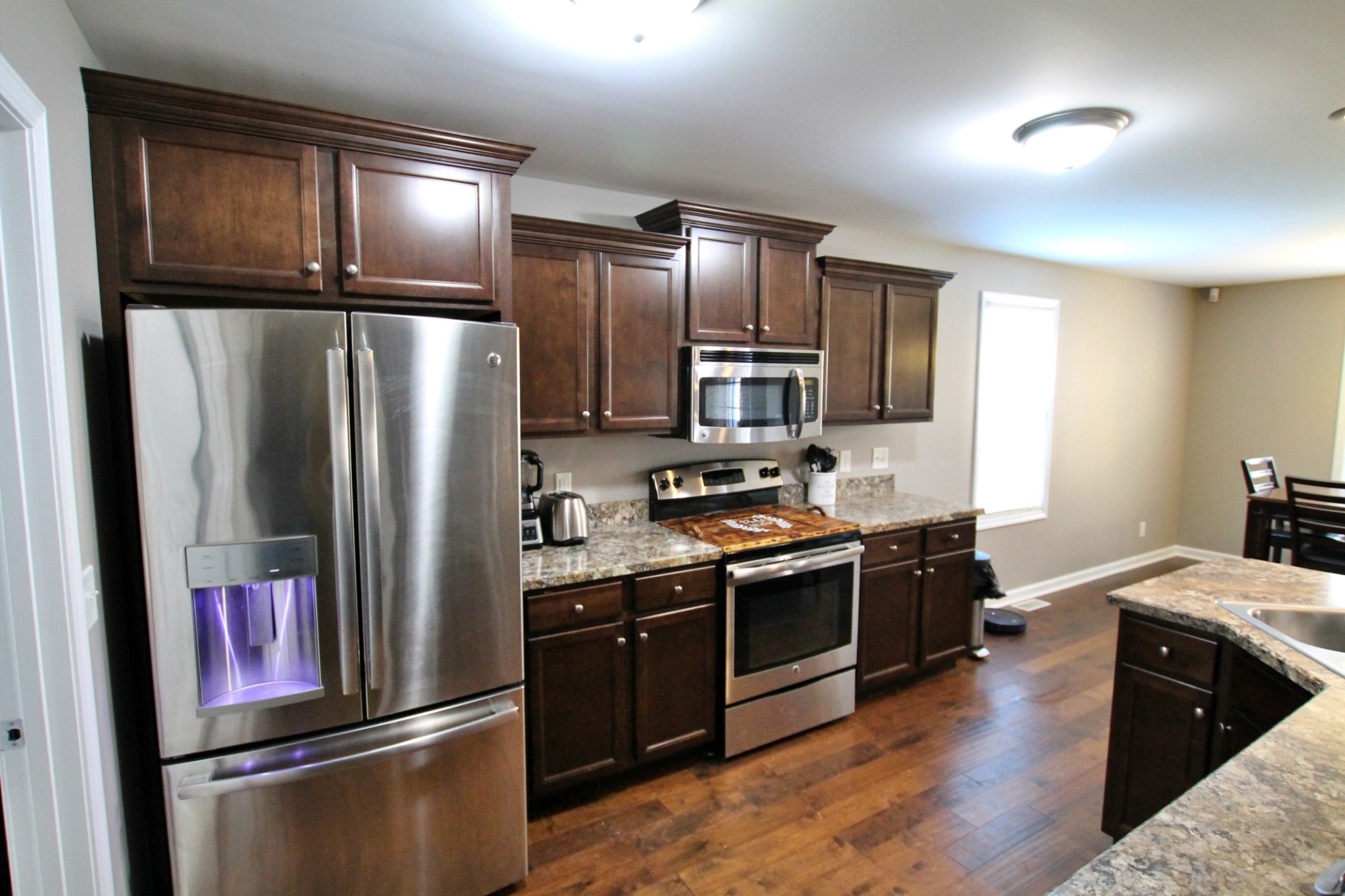 8005 New Chapel Road Springfield, TN 37172 - Photo 11 of 28 a kitchen with stainless steel appliances granite countertop a refrigerator a stove and a sink