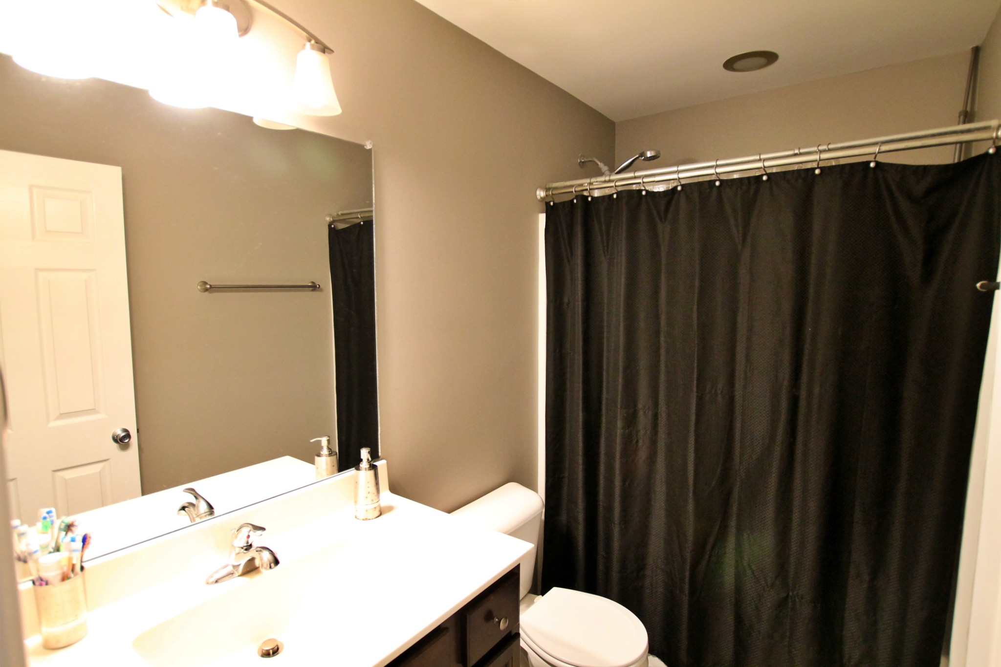 8005 New Chapel Road Springfield, TN 37172 - Photo 21 of 28 a bathroom with a sink and a mirror