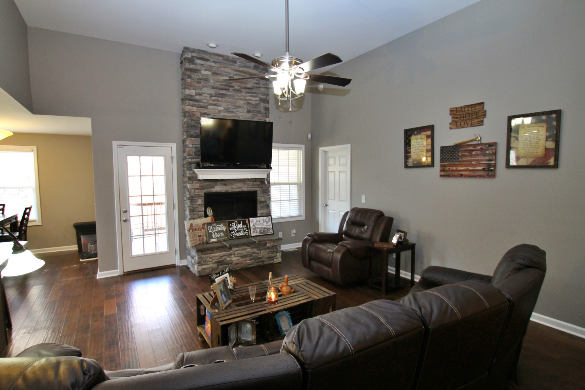 8005 New Chapel Road Springfield, TN 37172 - Photo 7 of 28 a living room with furniture a flat screen tv and a fireplace