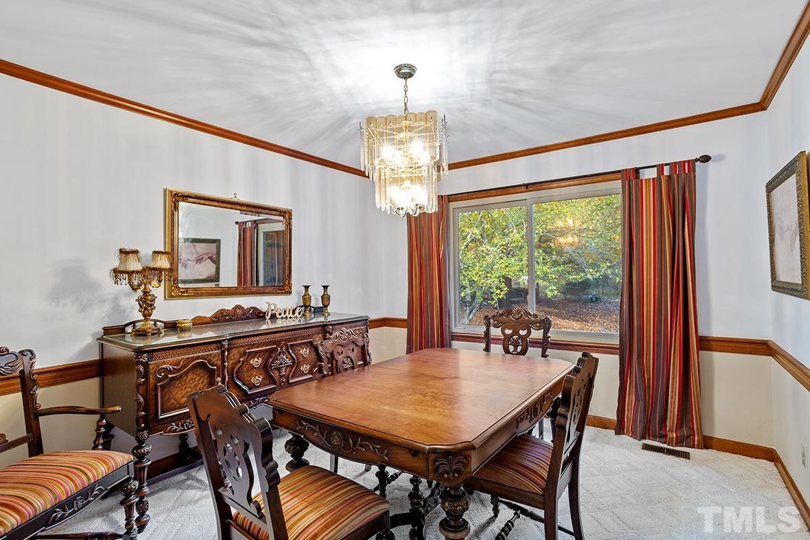 105 Carriage Trail Raleigh, NC 27614 - Photo 13 of 32 a view of a dining room with furniture window and outside view