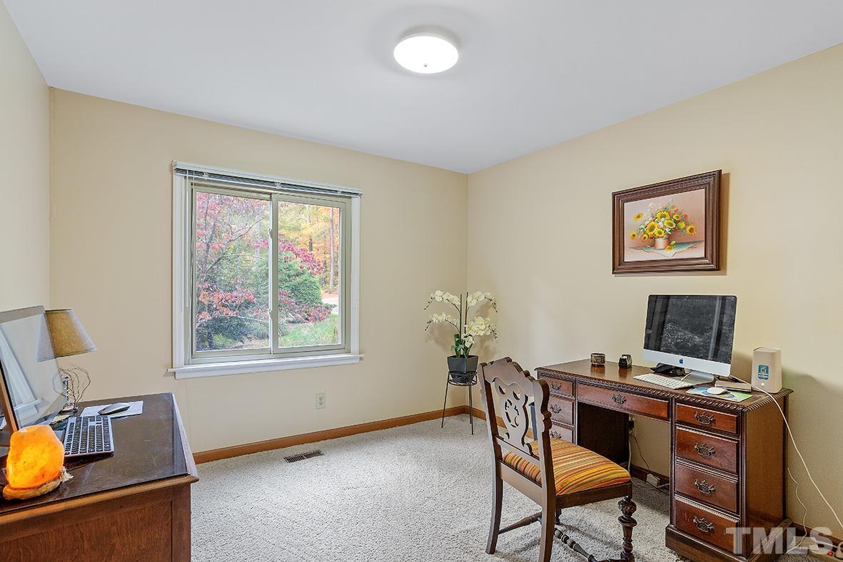 105 Carriage Trail Raleigh, NC 27614 - Photo 17 of 32 a workspace with furniture and window