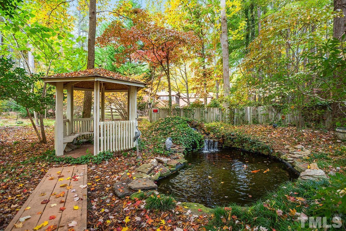 105 Carriage Trail Raleigh, NC 27614 - Photo 28 of 32 a backyard of a house with lots of green space
