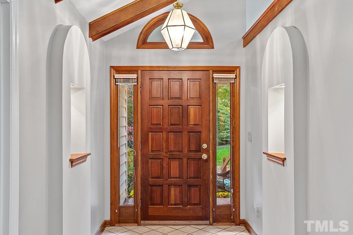 105 Carriage Trail Raleigh, NC 27614 - Photo 3 of 32 a view of front door with wooden door