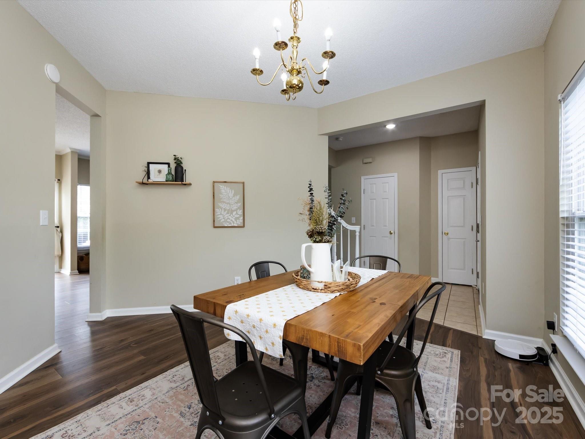 3910 Faith Church Road Indian Trail, NC 28079 - Photo 12 of 47 a view of a dining room with furniture and wooden floor