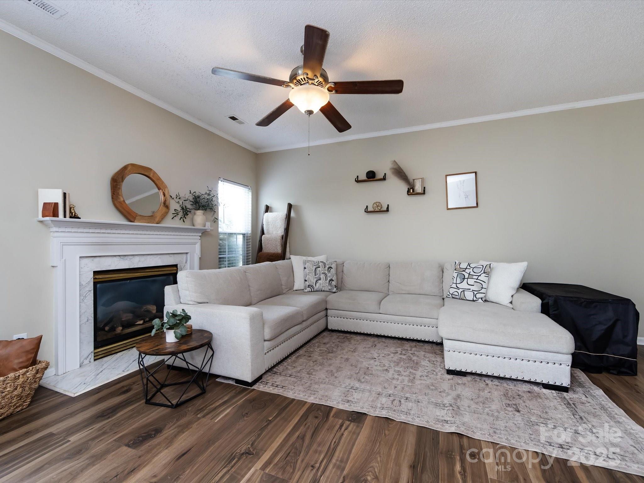 3910 Faith Church Road Indian Trail, NC 28079 - Photo 15 of 47 a living room with furniture and a fireplace
