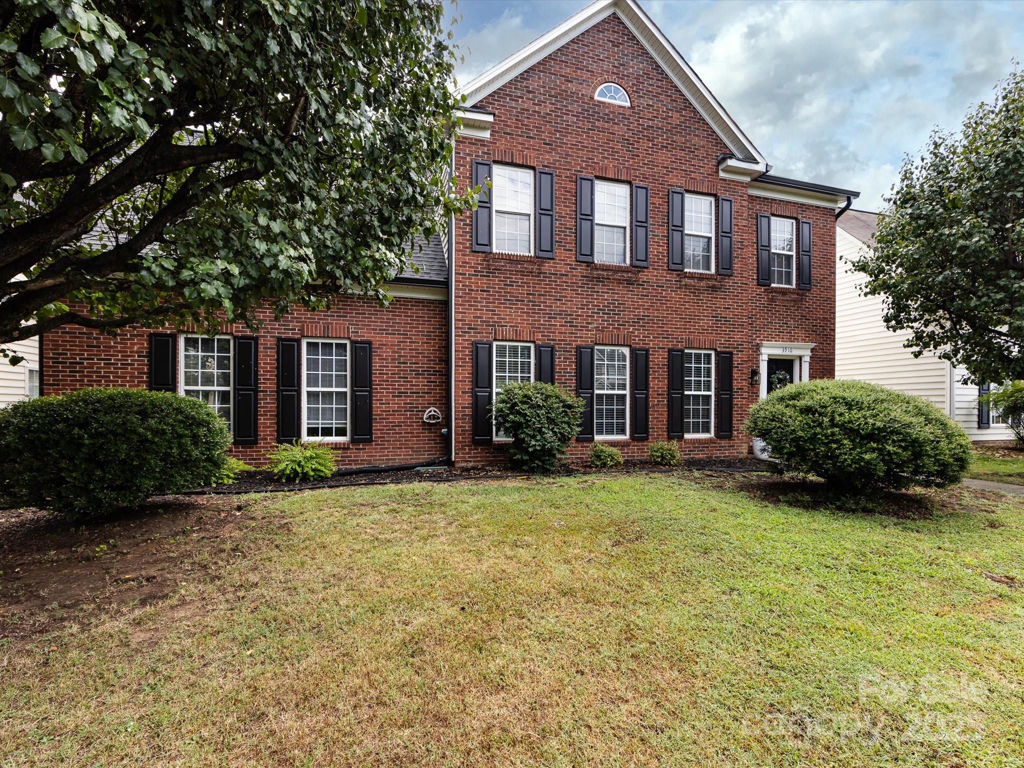 3910 Faith Church Road Indian Trail, NC 28079 - Photo 2 of 47 a front view of a house with garden