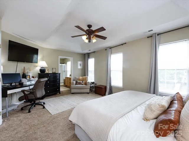 a bedroom with bed and window