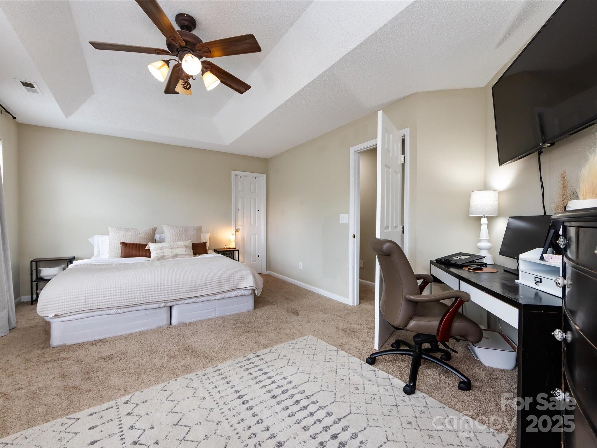 3910 Faith Church Road Indian Trail, NC 28079 - Photo 26 of 47 a bedroom with a bed a desk and chair
