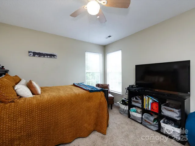 a bed room with furniture and a window