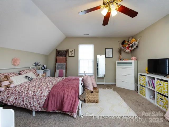 a bed room with a bed and a chandelier