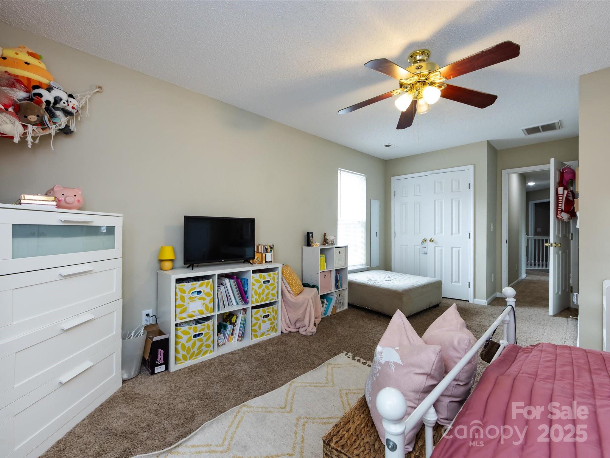 3910 Faith Church Road Indian Trail, NC 28079 - Photo 40 of 47 a living room with furniture and a flat screen tv