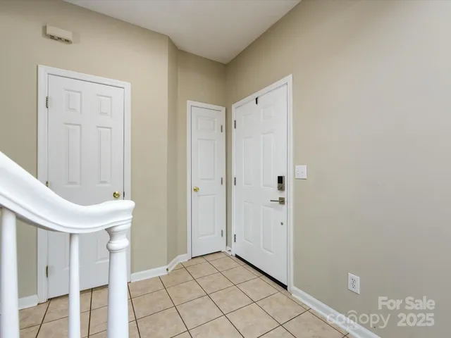 a view of a hallway with entryway door