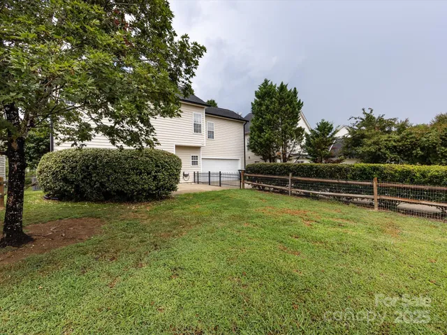 a view of a house with a back yard