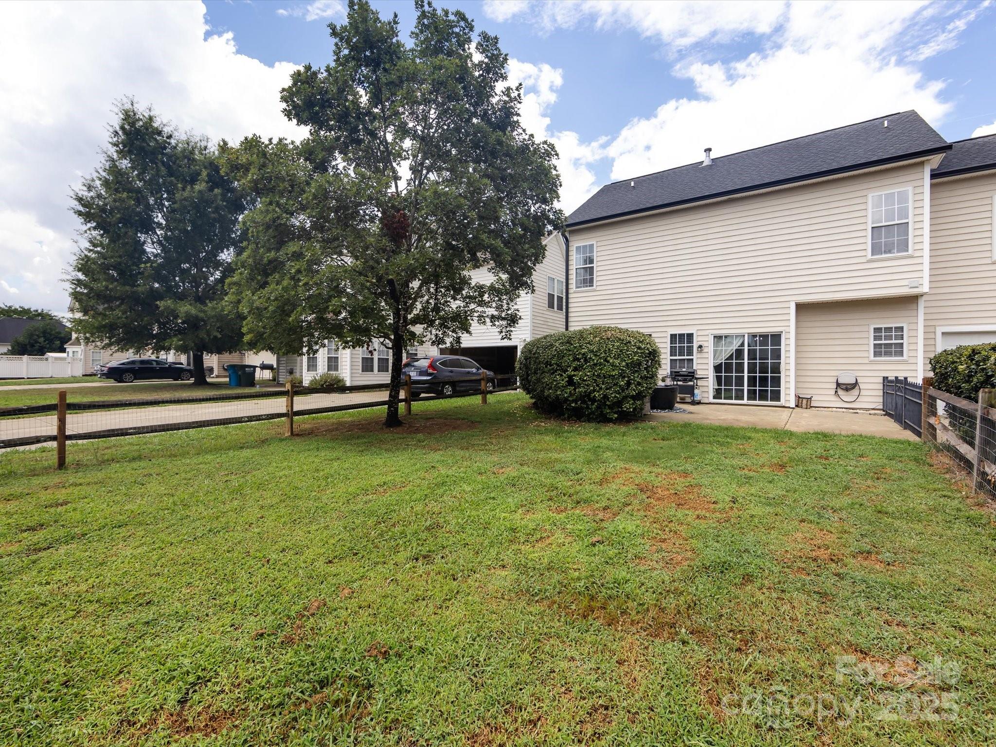 3910 Faith Church Road Indian Trail, NC 28079 - Photo 46 of 47 a view of a house with a back yard