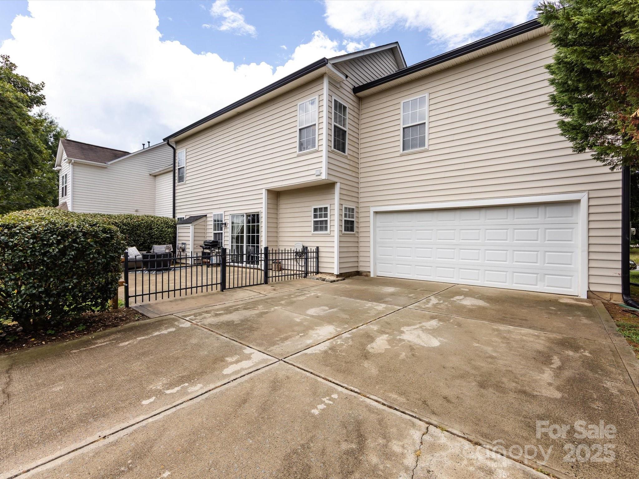 3910 Faith Church Road Indian Trail, NC 28079 - Photo 47 of 47 a backyard of a house with yard and outdoor seating