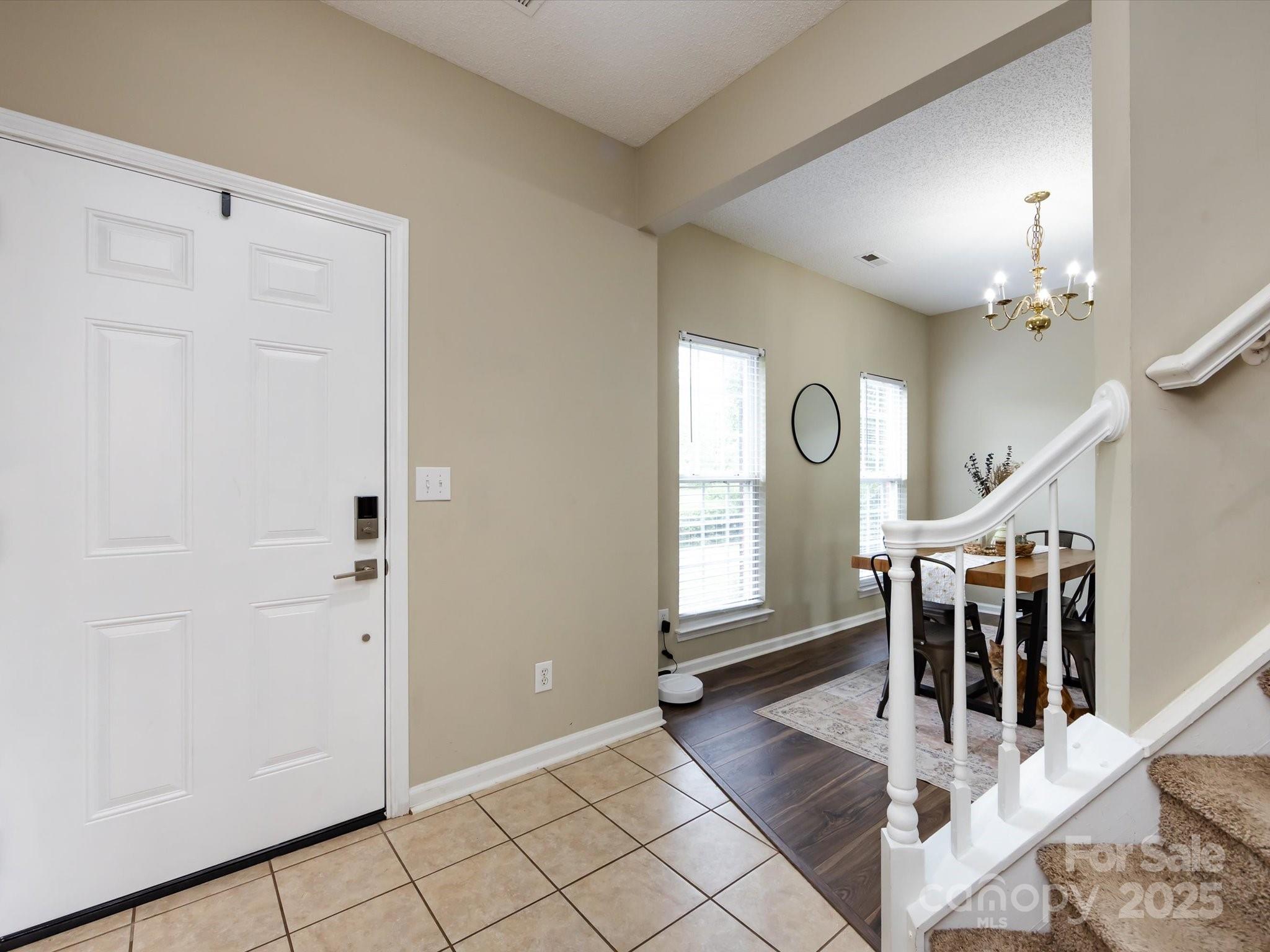 3910 Faith Church Road Indian Trail, NC 28079 - Photo 5 of 47 a view of entryway and hall with wooden floor