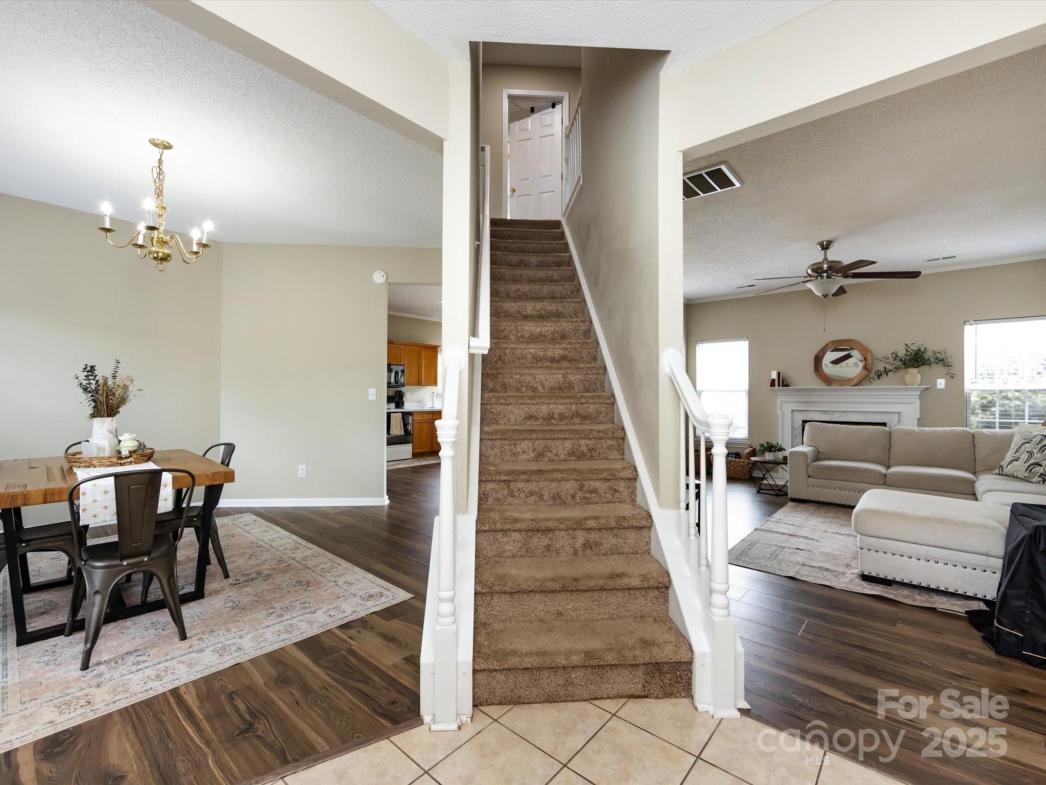 3910 Faith Church Road Indian Trail, NC 28079 - Photo 6 of 47 a living room with furniture and a chandelier