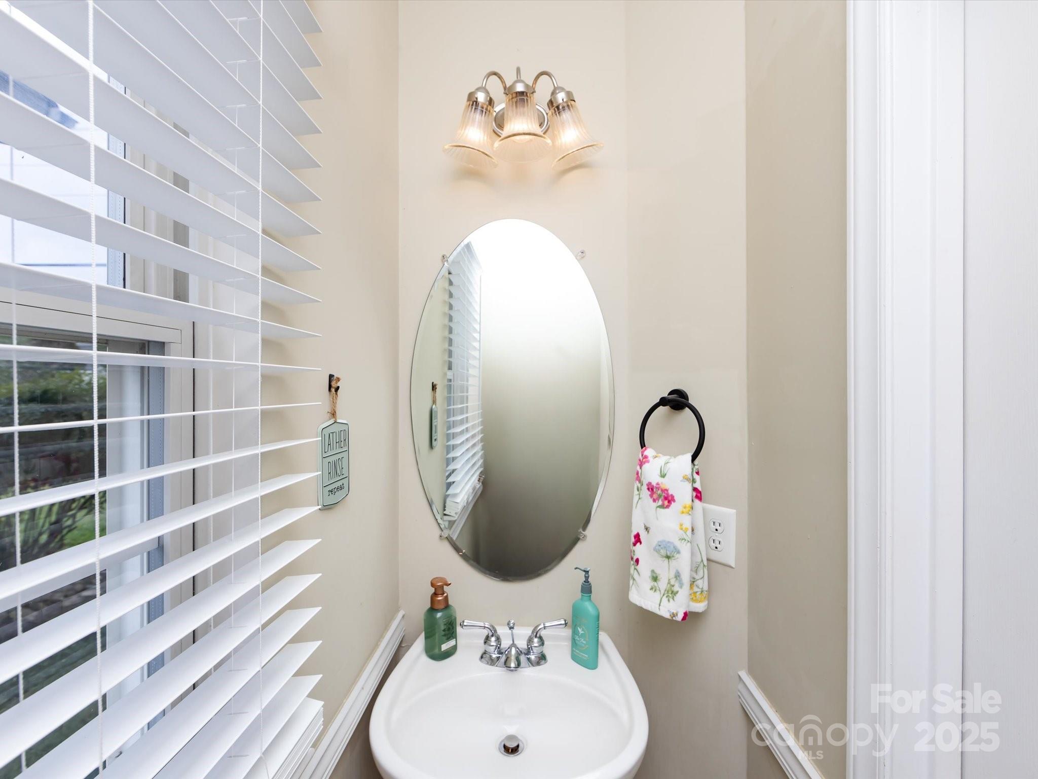 3910 Faith Church Road Indian Trail, NC 28079 - Photo 8 of 47 a bathroom with a bathtub and a mirror