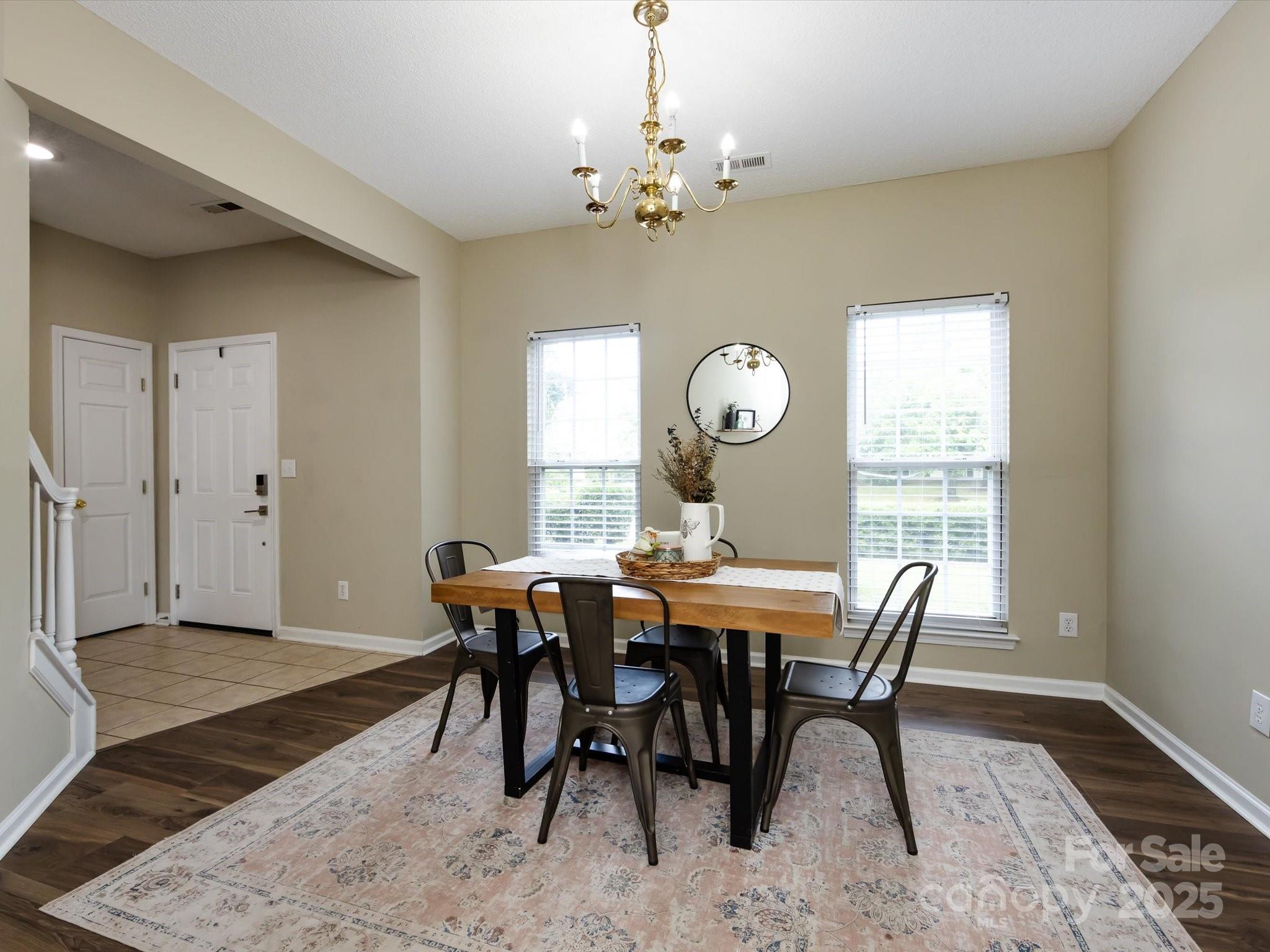 3910 Faith Church Road Indian Trail, NC 28079 - Photo 9 of 47 a view of a dining room with furniture and chandelier