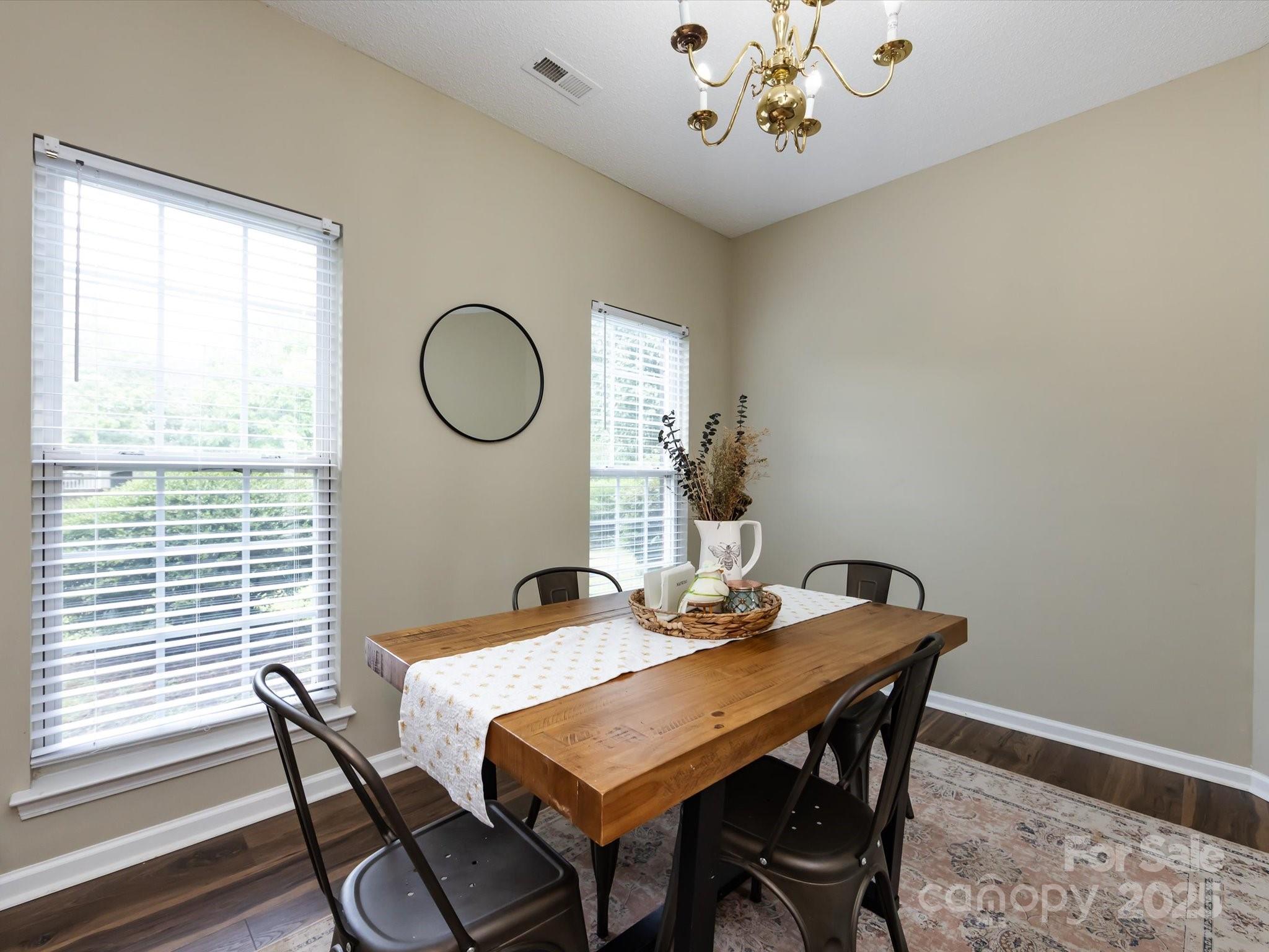 3910 Faith Church Road Indian Trail, NC 28079 - Photo 10 of 47 a dining room with a wooden table and chairs