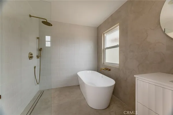 a bathroom with a bathtub and shower