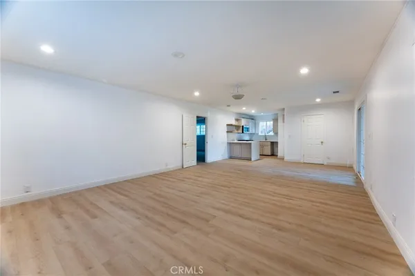 a view of empty room with kitchen appliances