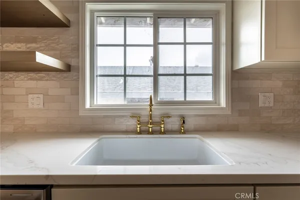 a bathroom with a bathtub and next to a window