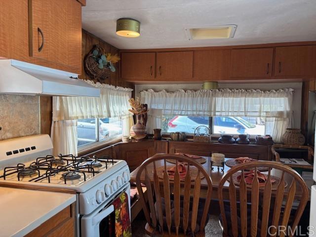 170 Diana Street, Unit 24 Encinitas, CA 92024 - Photo 15 of 26 a kitchen with a stove and a sink