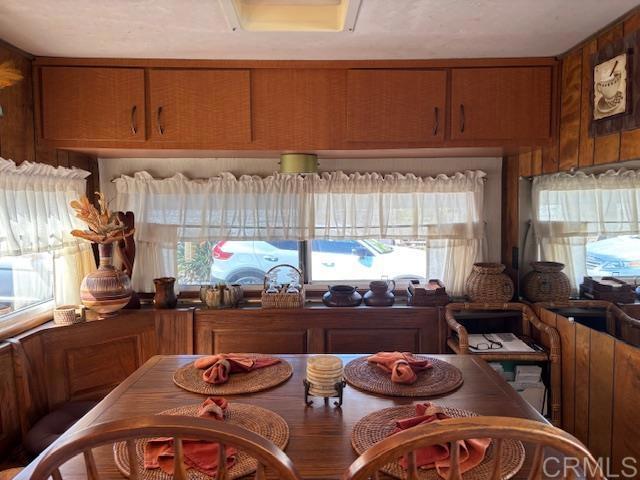 170 Diana Street, Unit 24 Encinitas, CA 92024 - Photo 16 of 26 a kitchen with stainless steel appliances wooden cabinets and a stove top oven
