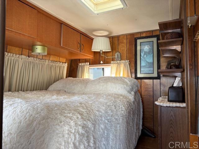 170 Diana Street, Unit 24 Encinitas, CA 92024 - Photo 19 of 26 a bedroom with a bed and cabinets