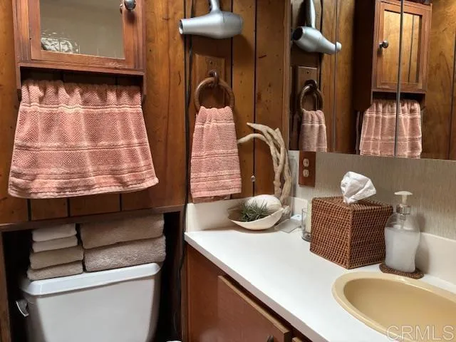 a kitchen with a stove two sinks and a refrigerator